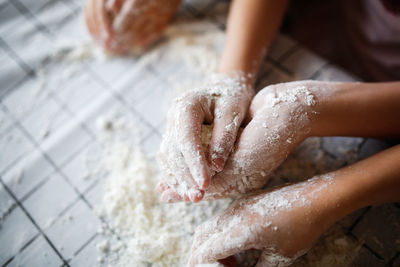 Cropped image of man washing hands