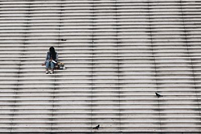 Woman sitting on steps