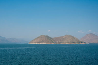 Scenic view of sea against blue sky