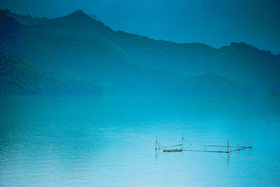 Scenic view of lake against blue sky