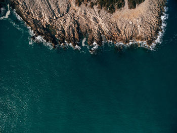 High angle view of rock formation in sea