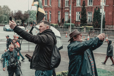 People standing on street in city