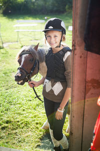 Outdoor portrait of girl with her horse