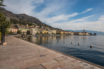  the beautiful lakeside of salò with the lake garda and the monte baldo in background