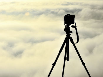 Low angle view of camera against sky