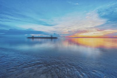 Scenic view of sea against sky at sunset