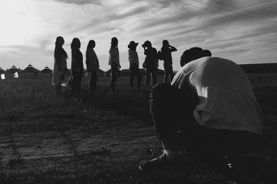 People at observation point against sky