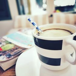 Close-up of coffee cup on table