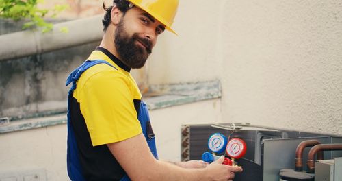 Side view of man working in factory