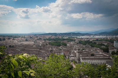 High angle view of buildings in city against sky