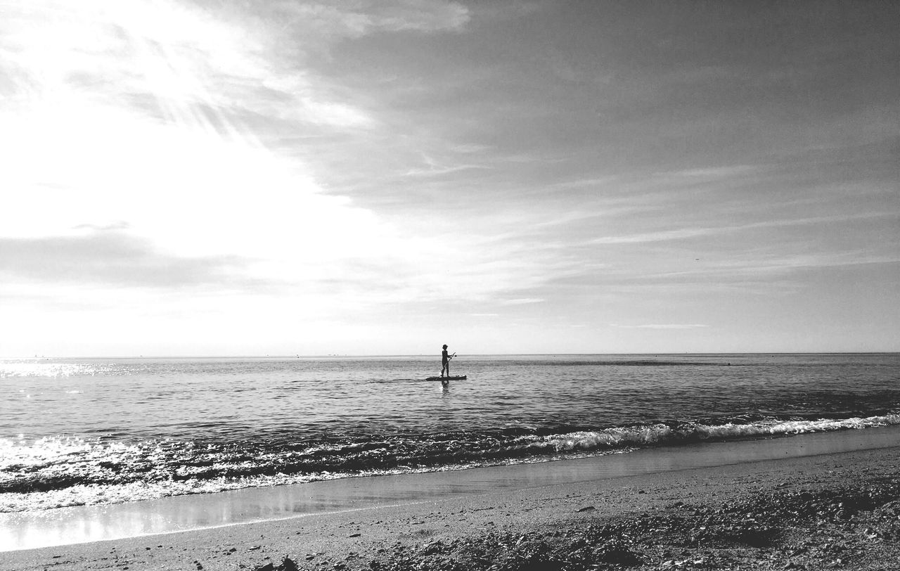 sea, horizon over water, water, beach, scenics, nature, beauty in nature, sky, tranquil scene, tranquility, one person, vacations, outdoors, travel destinations, day, real people, sand, wave, people