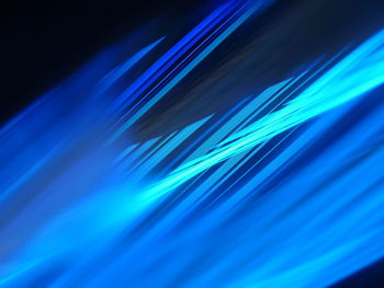 Blue light painting against black background