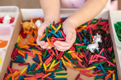 Midsection of woman holding christmas presents