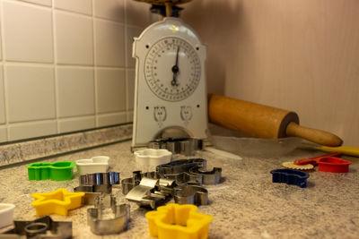 Close-up of clock on table at home