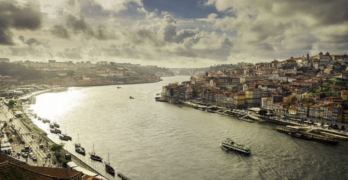 High angle view of river amidst buildings in city