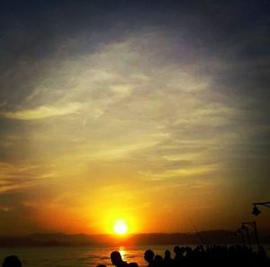 Scenic view of beach against sky during sunset