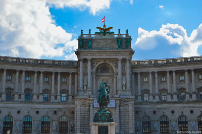 Low angle view of statue against cloudy sky