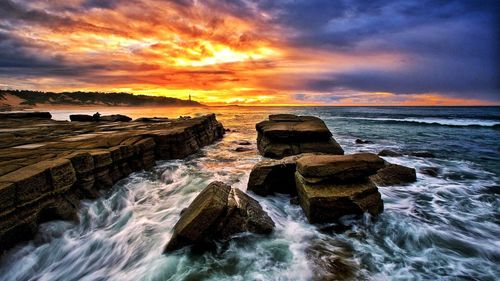 Scenic view of sea against sky during sunset