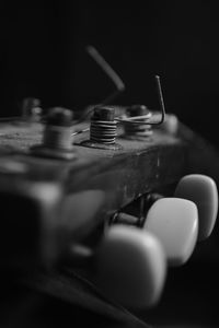 Close-up of electric lamp over black background