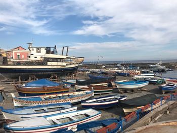 High angle view of fishing boats moored at harbor