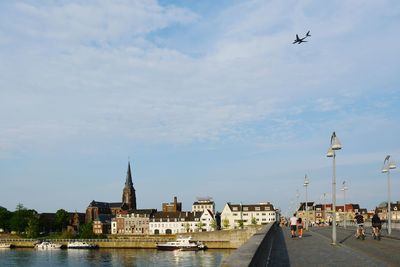 Airplane flying over city