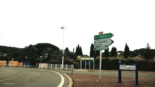 Road sign against clear sky