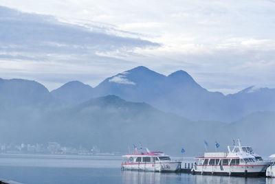 Scenic view of sea against cloudy sky