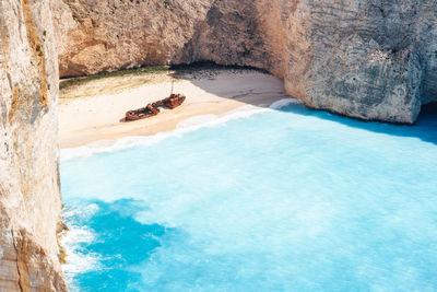 Aerial view of abandoned ship at beach