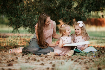 Mother and girl on plant