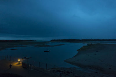 Scenic view of sea against sky at night