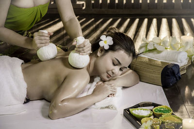 High angle view of woman sitting on table