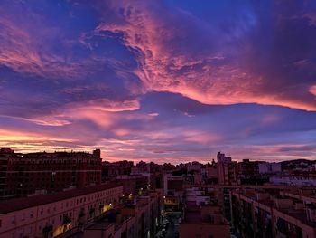 High angle view of buildings against sky during sunset