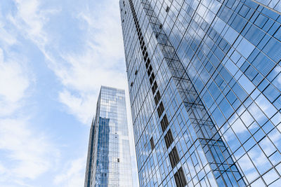 Low angle view of modern buildings against sky
