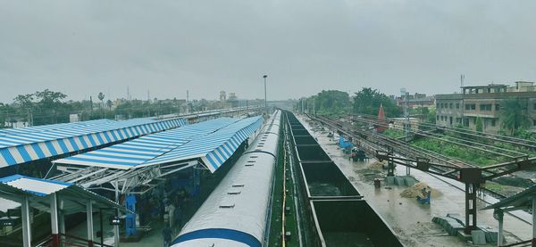 High angle view of train in city against sky