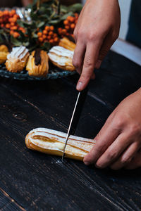Close-up of person preparing food on table