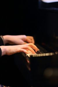 Cropped image of pianist playing piano