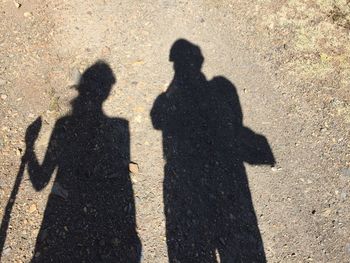 Shadow of couple on street