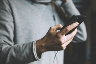 Close-up of man using mobile phone