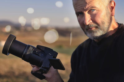Portrait of man photographing
