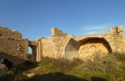 Old building against clear blue sky