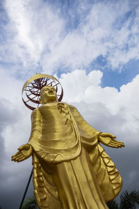 Low angle view of statue against sky