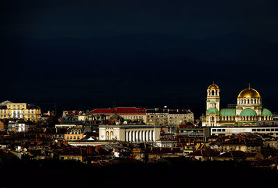Illuminated buildings in city at night