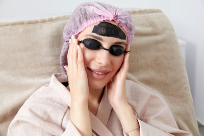 Portrait of young woman wearing sunglasses