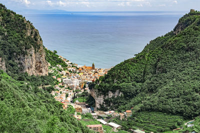 High angle view of buildings by sea