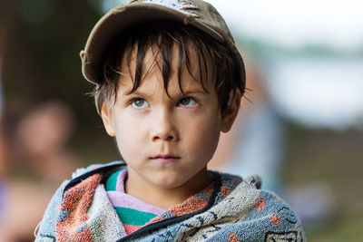 Close-up of cute boy looking away