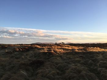 Scenic view of land against sky