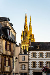 Low angle view of the cathedral of quimper agaisnt blue sky