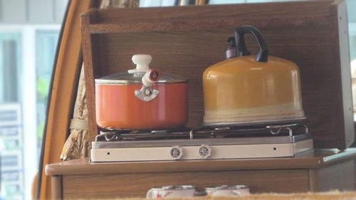 Cooking on stove inside volkswagen campervan