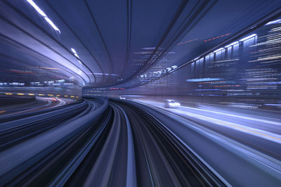 Light trails on railroad tracks at night