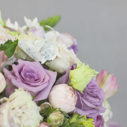 The delicate rustic floral bouquet of rose lilac peony on grey background